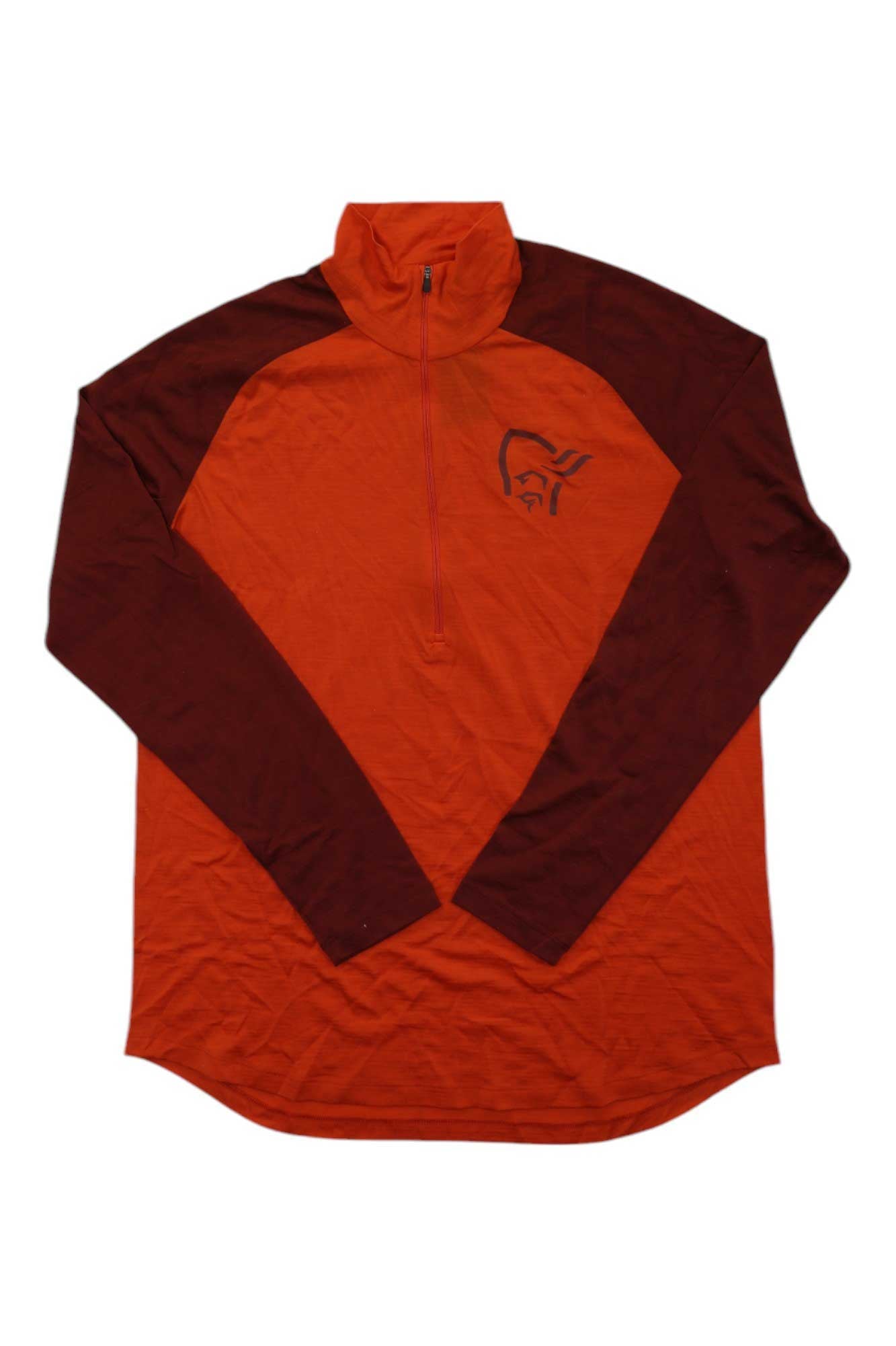 The Norrona Mens Pureull Zip Neck Top is a long-sleeve athletic shirt with a red-orange body, darker red sleeves, a stylized face logo on the left chest, and moisture-wicking fabric for all-day comfort.