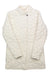 The Obermeyer Womens Perry Down Parka is an off-white, long-sleeve insulated jacket with a high collar, single visible neck button, and a grid-like texture. It’s shown laid flat with arms crossed at the wrists.