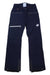 The Mammut Womens Stoney HS Pants are dark blue all-mountain hardshell ski pants featuring zippered pockets, a white logo on the right thigh, reinforced cuffs, belt loops, and a reflective strip on the left pocket.