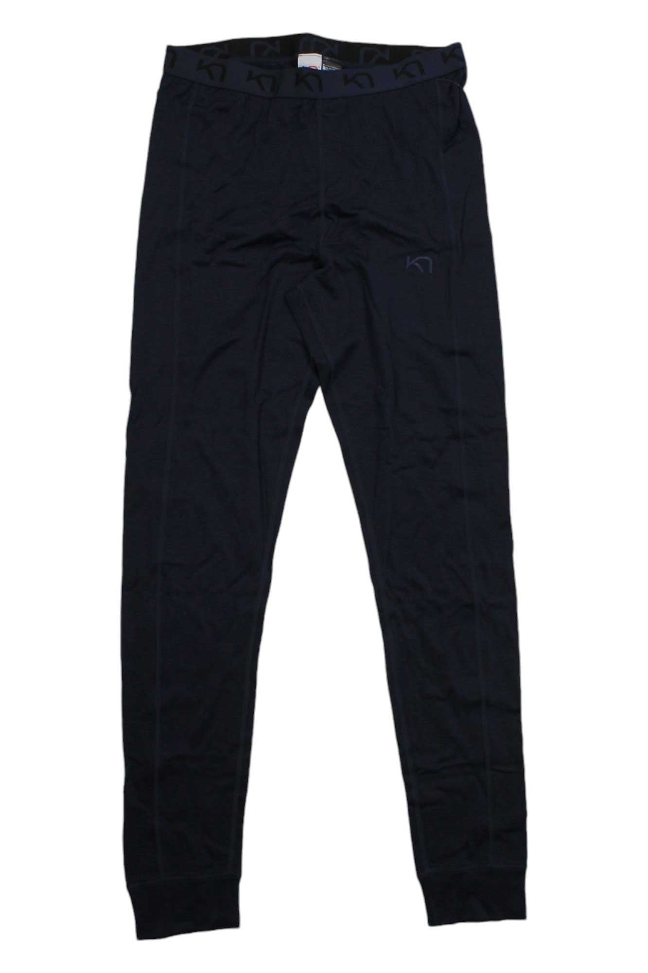 The Kari Traa Women's Klara HW Pant, shown in black with an elastic waistband and sleek design, offers odor resistance, comfort, and warmth—ideal as a merino wool base layer for winter activities.