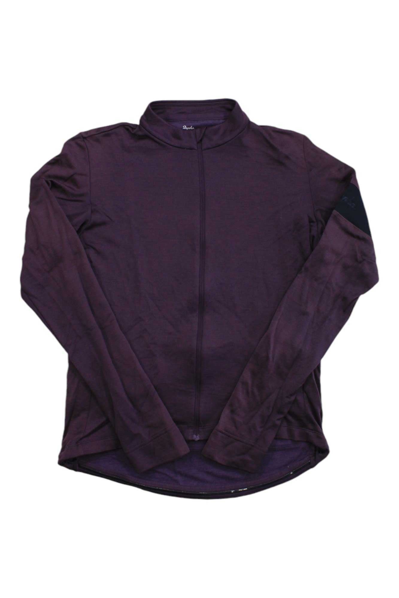The Rapha Men's Classic Long Sleeve Jersey, shown in dark purple with a front zipper and small collar, is a premium merino wool cycling jersey ideal for stylish cyclists.