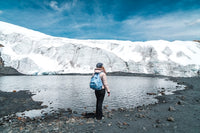 person looking at snowy mountain