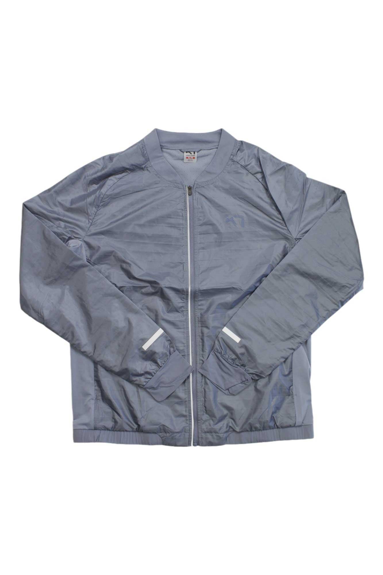 The Kari Traa Women's Sigrun Jacket is a light gray, long-sleeve fitness jacket with a front zipper, ribbed collar, cuffs, and hem, and two angled side pockets with white trim, displayed flat on a white background.