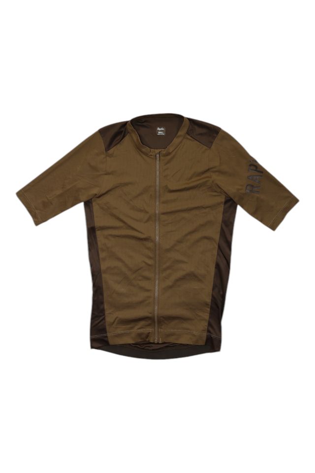 The Pro Team Aero Jersey II is a brown short-sleeve cycling jersey with a front zipper, darker brown side panels, and "RAPHA" on the left sleeve, laid flat on a white background.