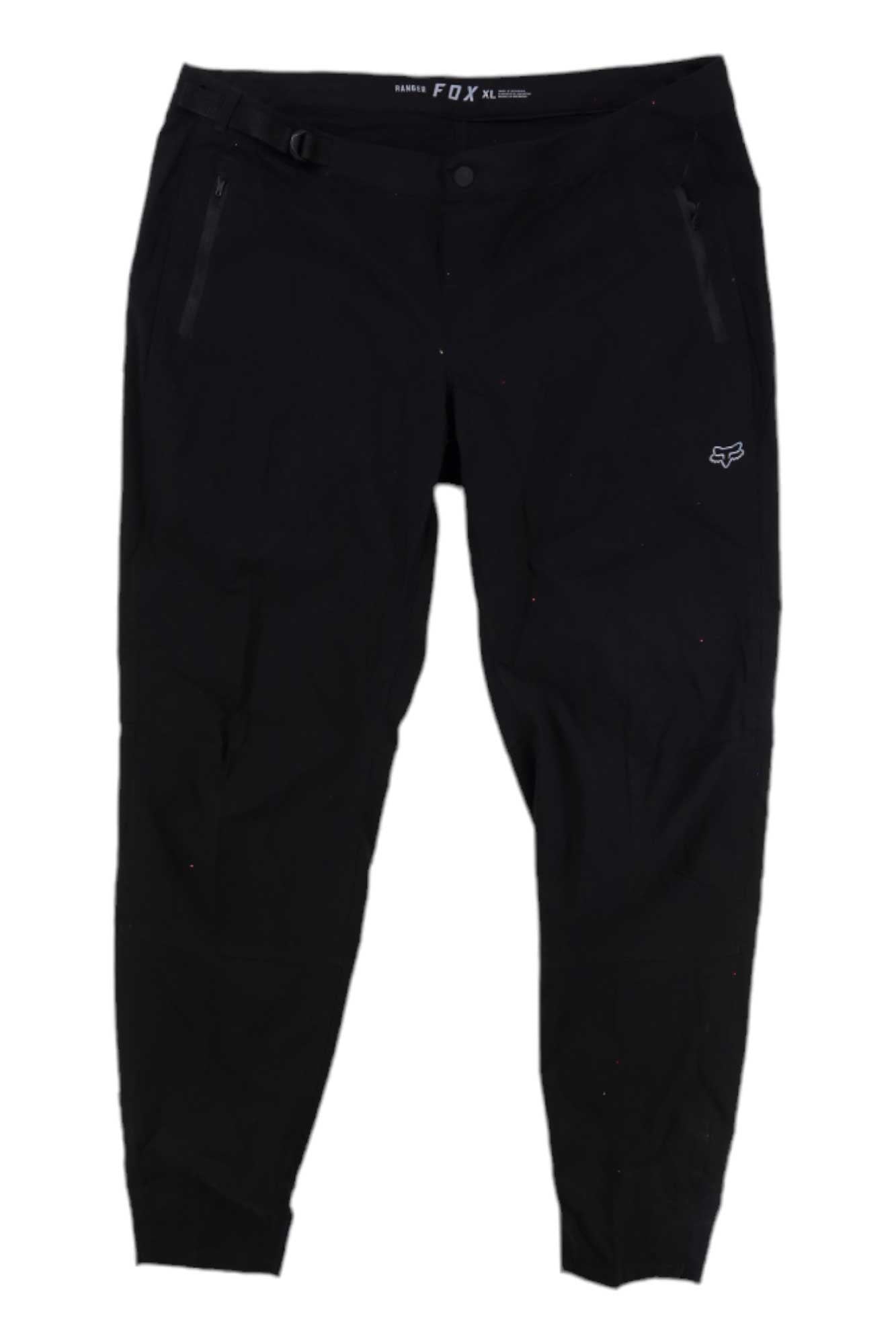 The Fox Womens Ranger Pant is a black mountain bike pant made from technical stretch fabric, featuring zippered pockets and a small white Fox logo on the left thigh, shown flat against a white background.