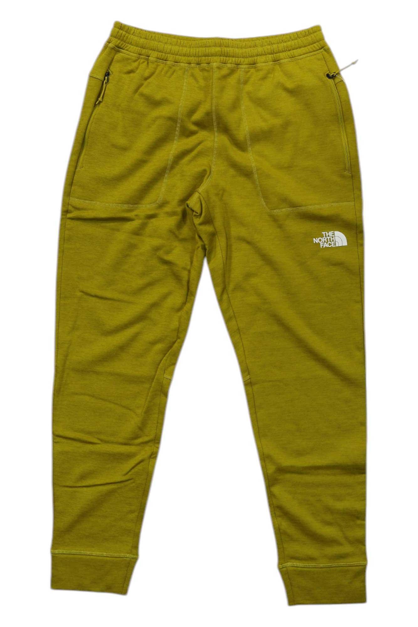 Men's yellow jogger pants with elastic waistband, tapered legs, cuffed hems, The North Face logo