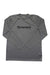 The Simms Mens Tech Tee is a lightweight, breathable gray long-sleeve shirt with "SIMMS" in bold black letters across the chest, shown laid flat on a white background. Moisture-wicking for comfort and performance.
