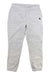 The Carhartt Womens Relaxed Fit Jogger in light gray features an elastic waistband and cuffs, side pockets, and a small black logo on the left hip, shown laid flat on a white background.