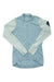 The Rapha Women's Pro Team Long Sleeve Training Jersey, in light blue with pale sleeves and a dark blue patch on the left upper arm, is perfect for your next training ride. Shown laid flat on a white background.