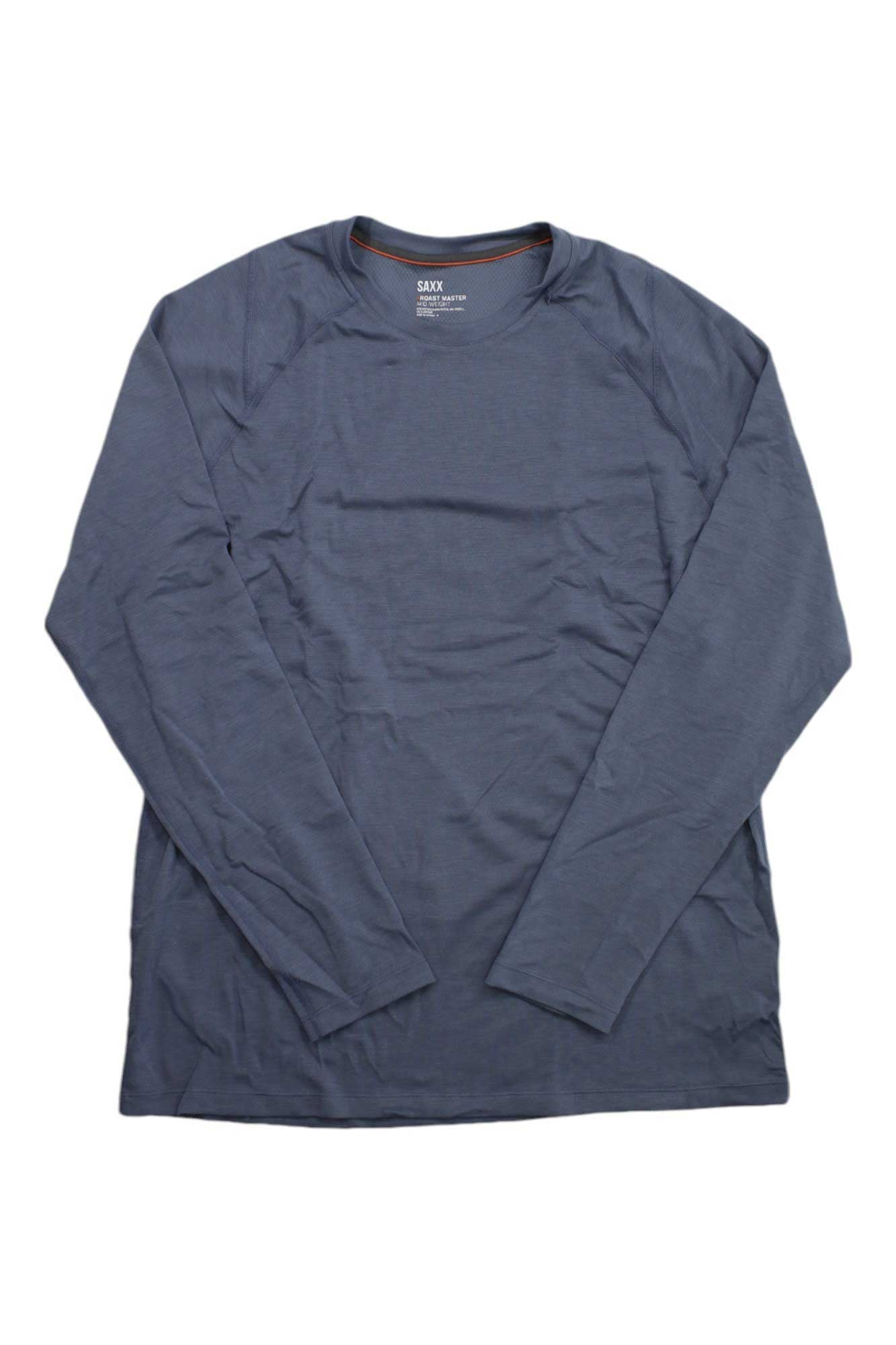 The SAXX Men's Roast Master Midweight Baselayer LS Crew in solid slate blue is a long-sleeve, crew neck shirt laid flat on a white background. Its lightweight fabric offers comfort and excellent moisture-wicking for active or daily wear.