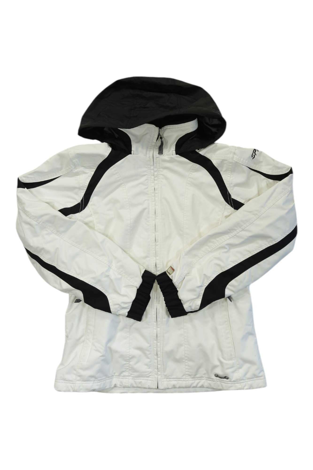 The Womens Spyder Ski Jacket is a white insulated ski jacket featuring black accents on the hood, shoulders, and sleeves, shown laid flat with arms crossed at the front.