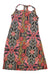 The Prana Womens Sleeveless Dress features a vibrant pink, orange, yellow, black, and gray geometric and floral pattern. Made from recycled materials, it has a chic halter neckline with a stylish back keyhole detail.