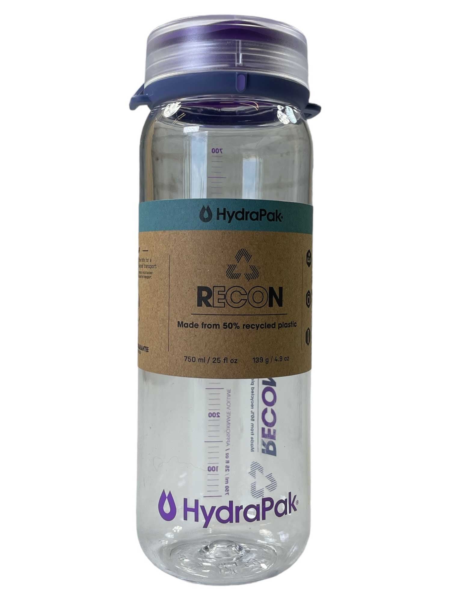 The Hydrapak Recon 750 Bottle is a clear, leakproof water bottle with a translucent lid, volume markings, bold purple branding, a paper label, and is made from 50% recycled plastic.