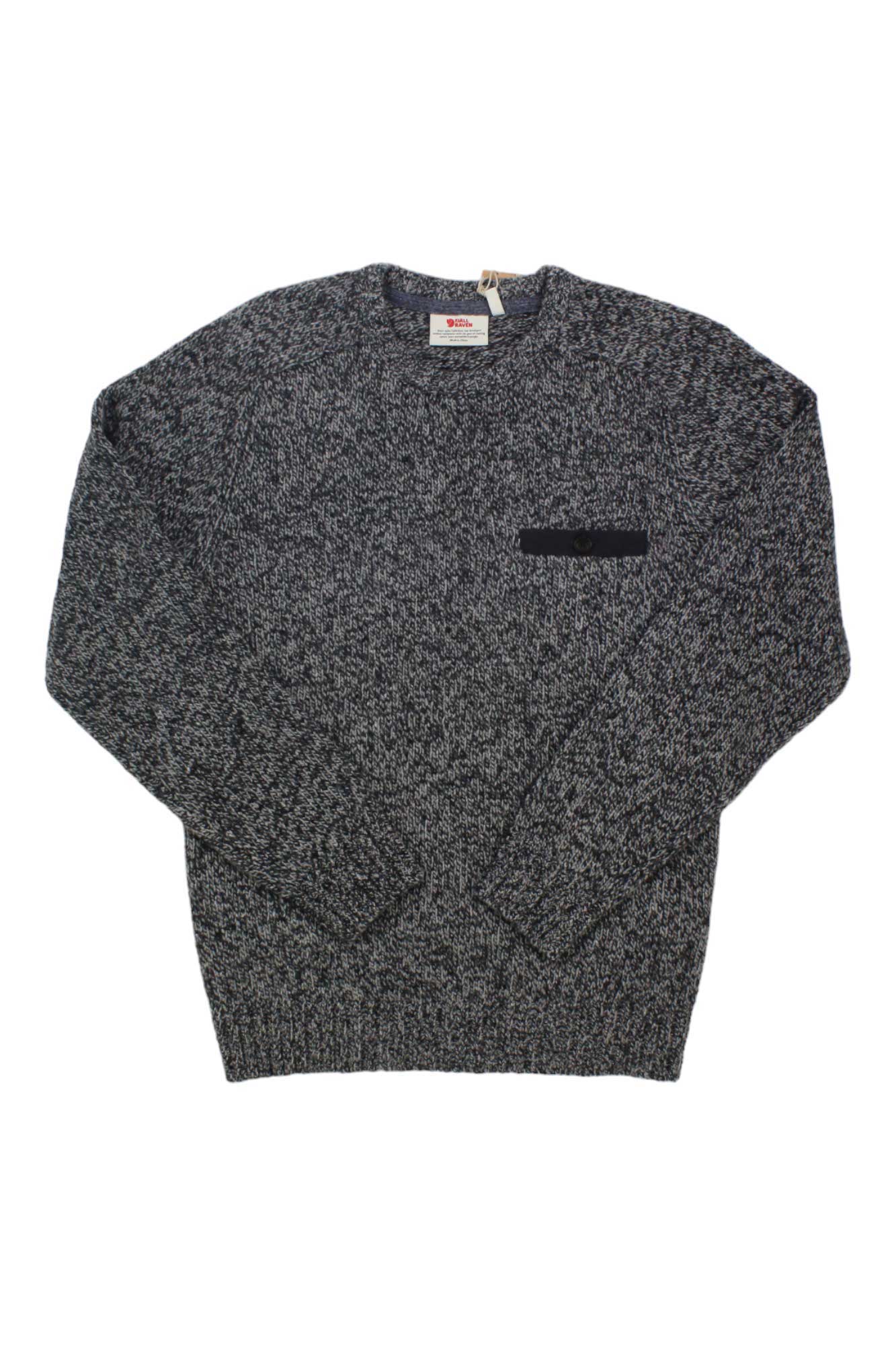 The Fjallraven Mens Lada Round-Neck Sweater, shown laid flat on a white background, features a gray and black marled knit lambswool, long sleeves, a crew neckline, and a small black patch on the left chest.