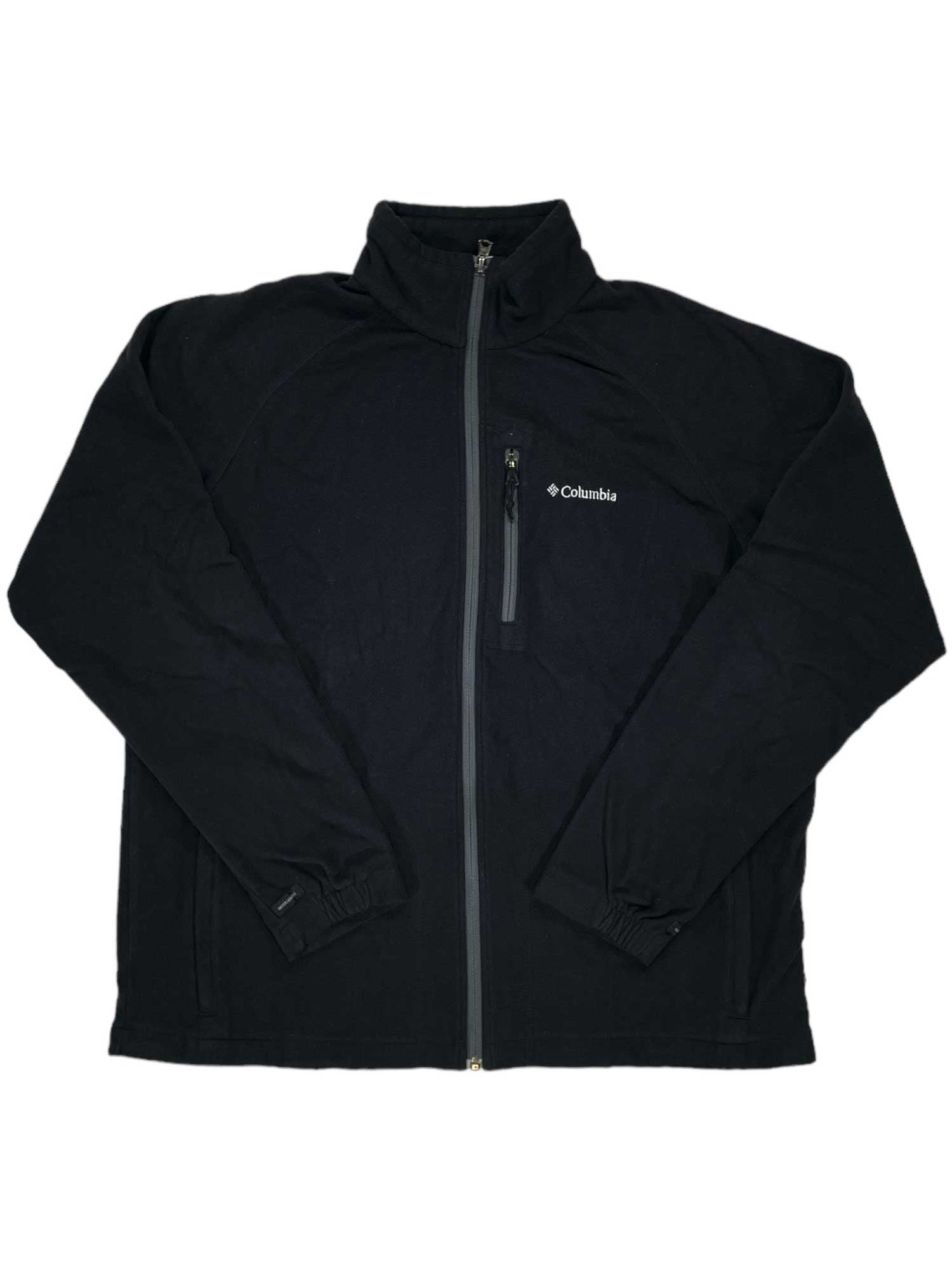 The Fast Trek II Full Zip Fleece by Columbia is a black jacket with a full front zipper, high collar, zippered chest pocket, elastic cuffs, and the Columbia logo on the left chest. It’s shown laid flat on a white background.