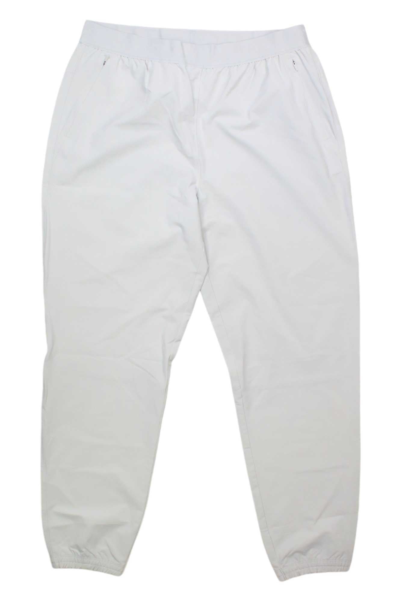 White jogger pants with elastic waistband and cuffed ankle hems