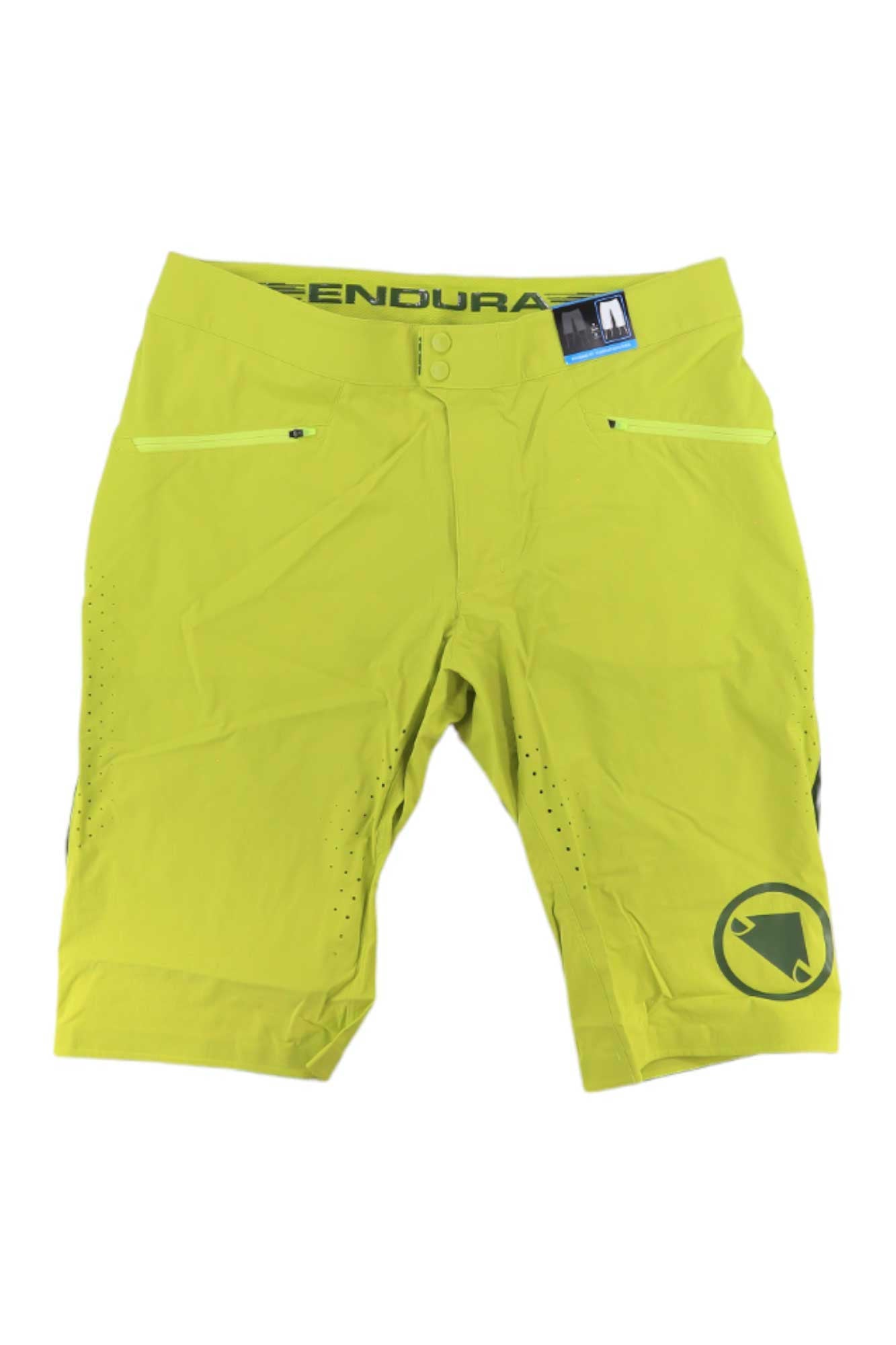 The Endura Mens SingleTrack Lite Short is a bright yellow-green stretch nylon cycling short with zippered front pockets, small ventilation holes, and a black logo on the lower left leg—ideal for mountain biking. Displayed on a plain white background.