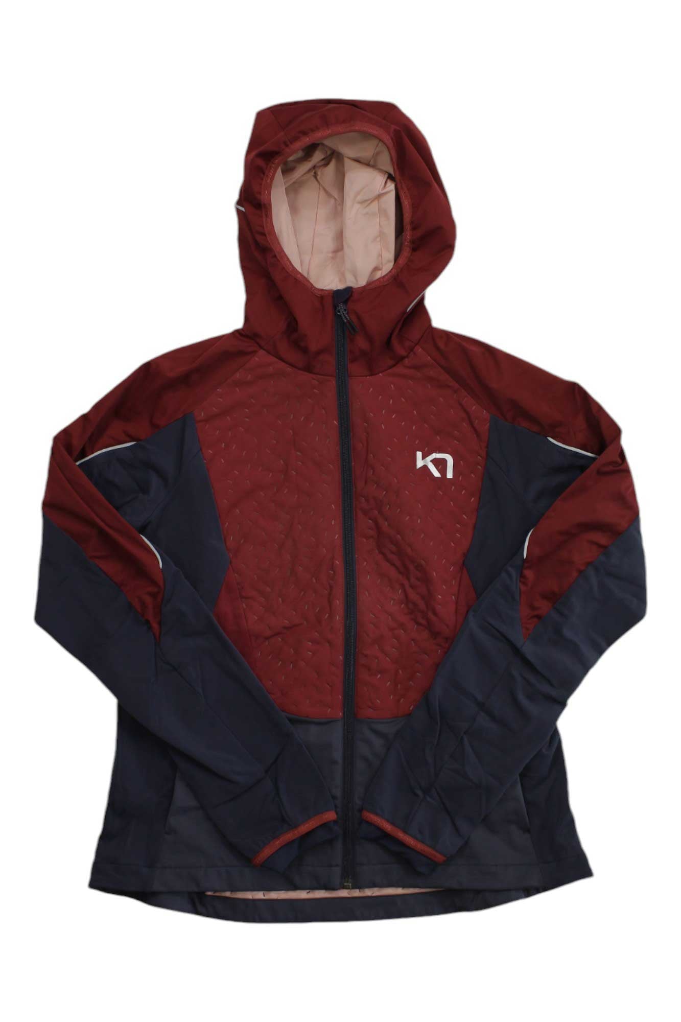 A Kari Traa Womens Tirill 2.0 Jacket in maroon and navy, made from recycled polyester with a beige hood lining, front zipper, and white K7 logo on the left chest, is laid flat on a white background.