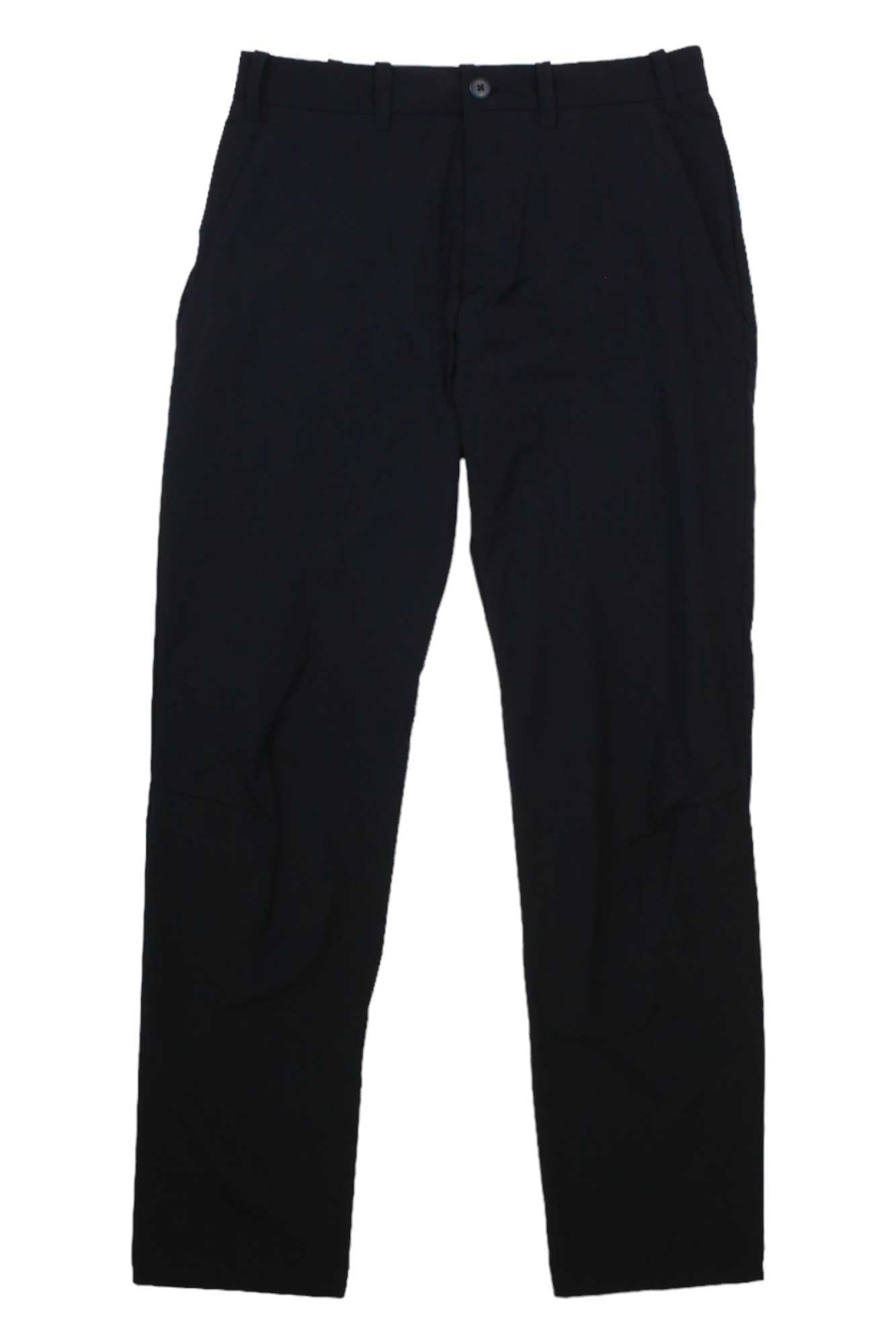 The Houdini Men's Omni Pant is a pair of plain black, stretchy, quick-drying pants with belt loops, side pockets, and a button waist closure, shown flat on a white background.