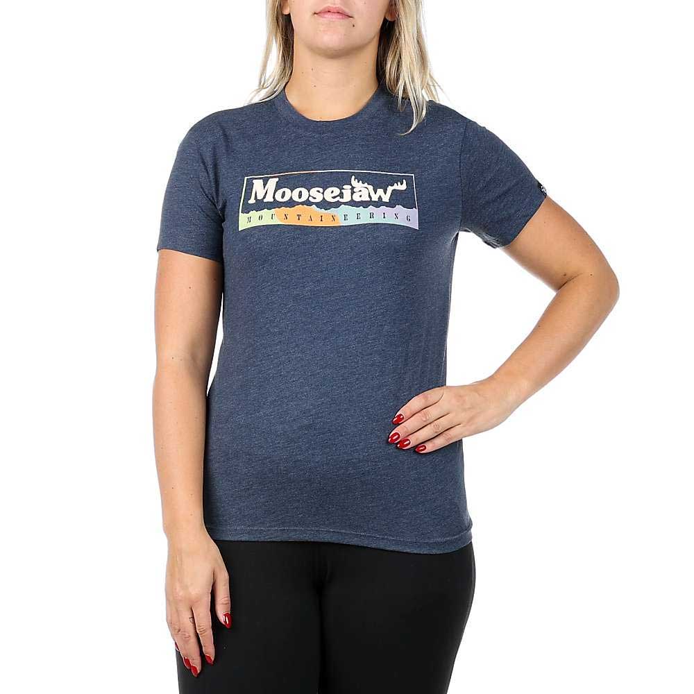 A woman in a Moosejaw Women's Original Frame SS Tee, made from organic cotton and recycled polyester, stands with one hand on her hip against a plain white background.