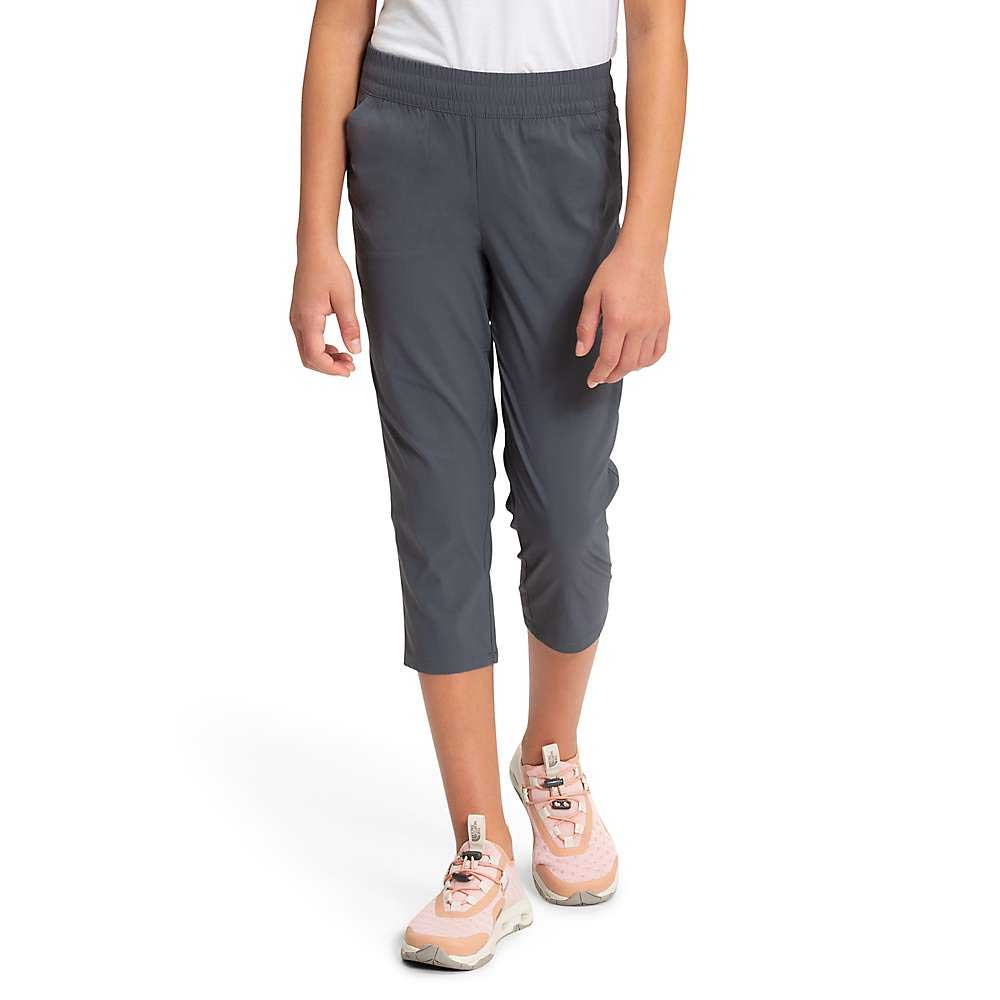 Grey capri pants with tapered legs and elastic waist, worn mid-calf