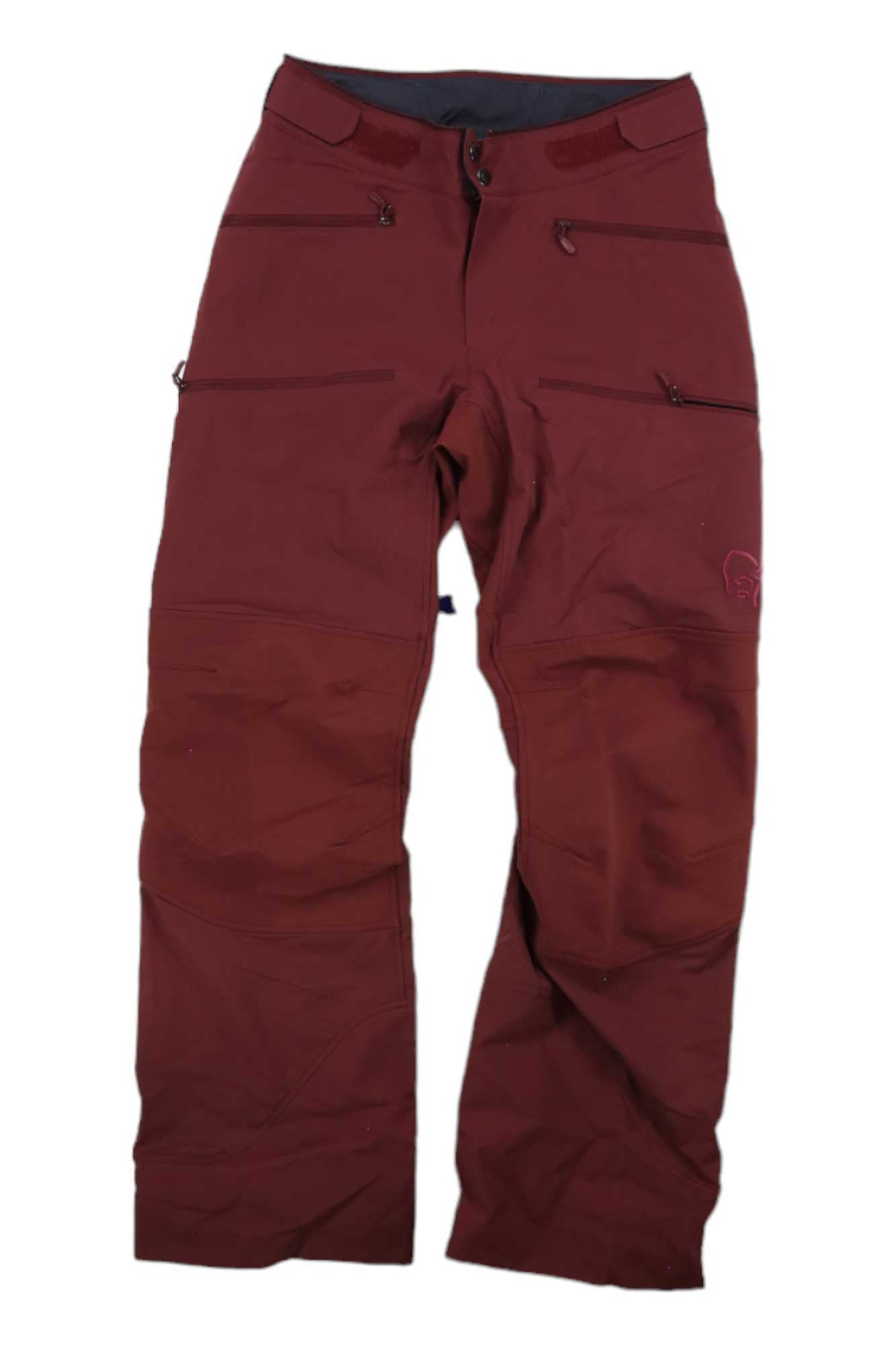 The Norrona Womens Lyngen Flex1 Pant in maroon features zipper pockets, reinforced knees, and a button waist closure. Windproof and breathable, these outdoor pants are ideal for active adventures. Shown laid flat on a white background.