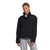 A person wears a black The North Face Women's Cragmont Fleece 1/4 Snap Top and light gray recycled polyester sweatpants, standing against a plain white background and looking at the camera with a neutral expression.