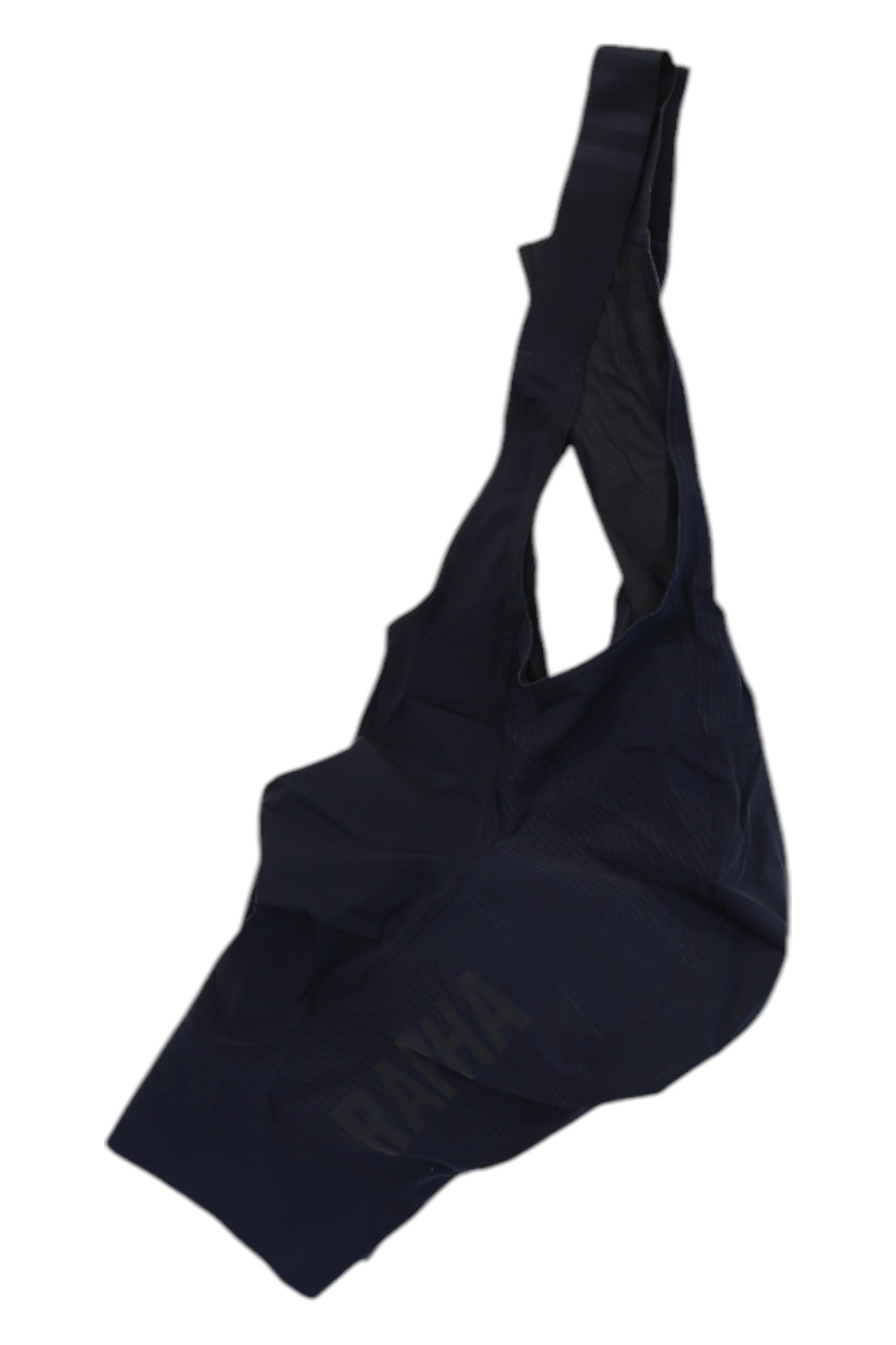 A crumpled dark navy Rapha Womens RCC Bib Shorts, featuring subtle RAPHA branding and a single shoulder strap, is displayed against a white background.