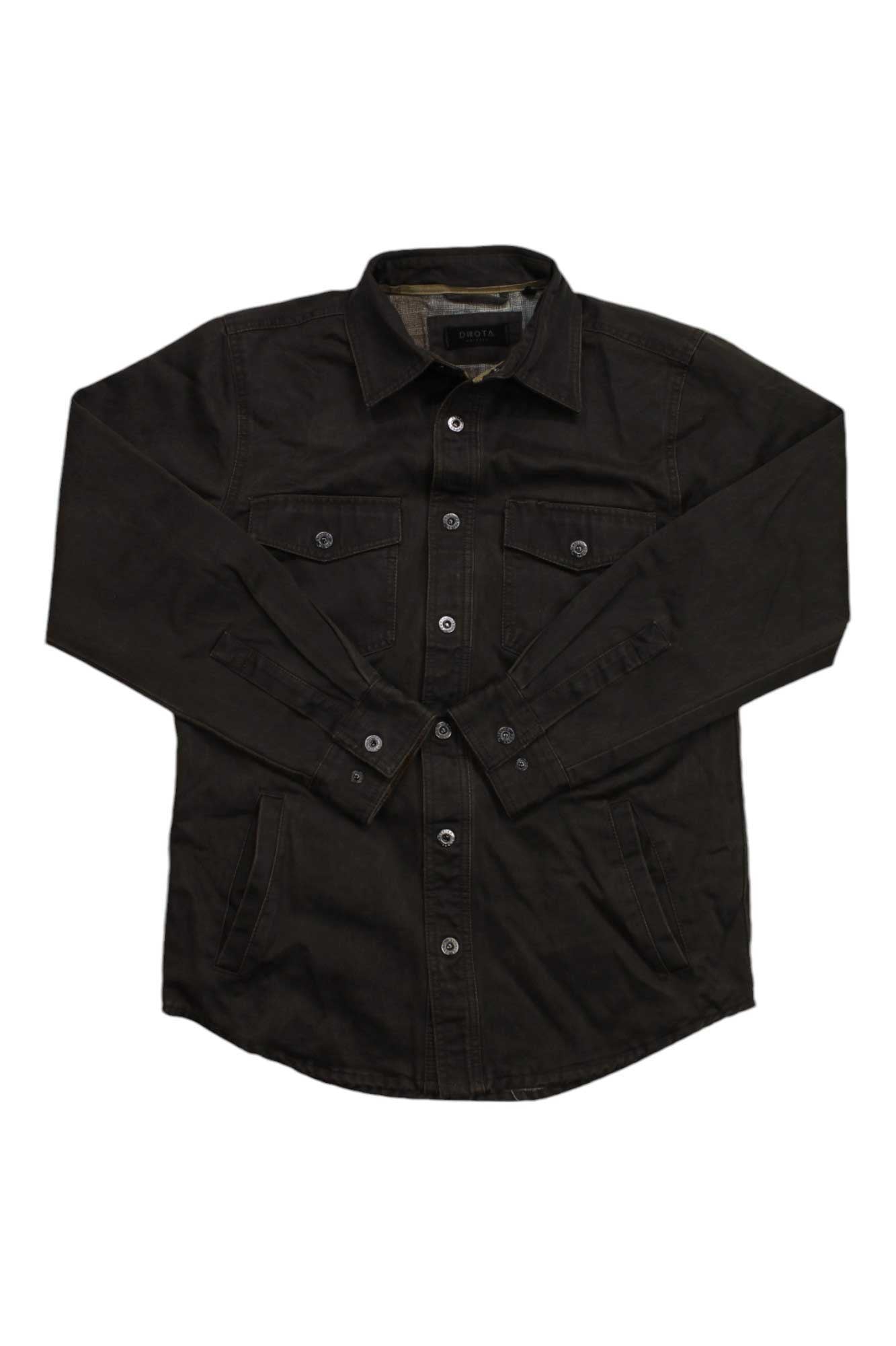 The Dakota Grizzly Mens Blaize Shirt Jacket is a black, flannel-lined shirt jacket with long sleeves, two chest pockets, and side travel pockets, shown laid flat on a white background.