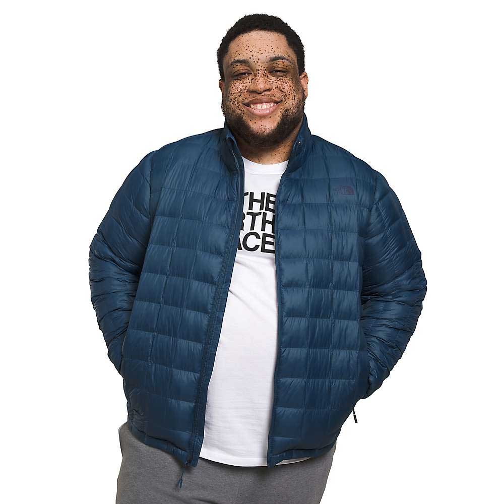 Men's blue quilted puffer jacket, full-zip, stand collar, elastic cuffs