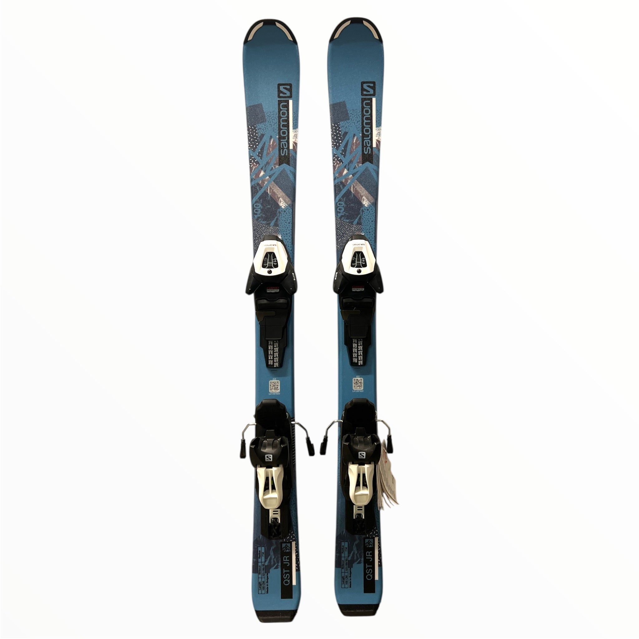 A pair of Salomon QST Junior Skis with Salomon 6 Demo Bindings are pictured side by side on a plain white background.