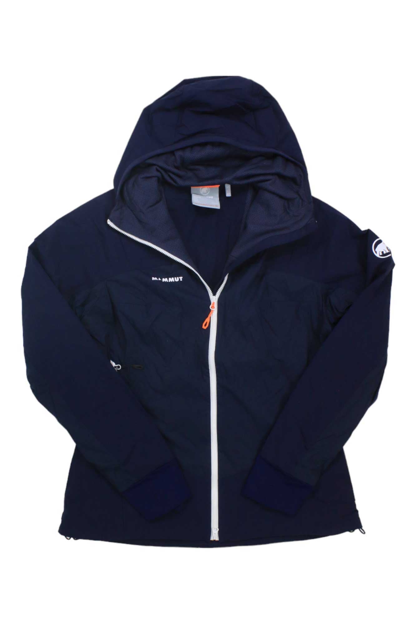 A Mammut Womens Taiss IN Hybrid Hooded Jacket in navy blue, featuring a white front zipper, orange pull, and MAMMUT logos on chest and sleeve. Laid flat with open hood, its mesh lining is ideal for alpine conditions.
