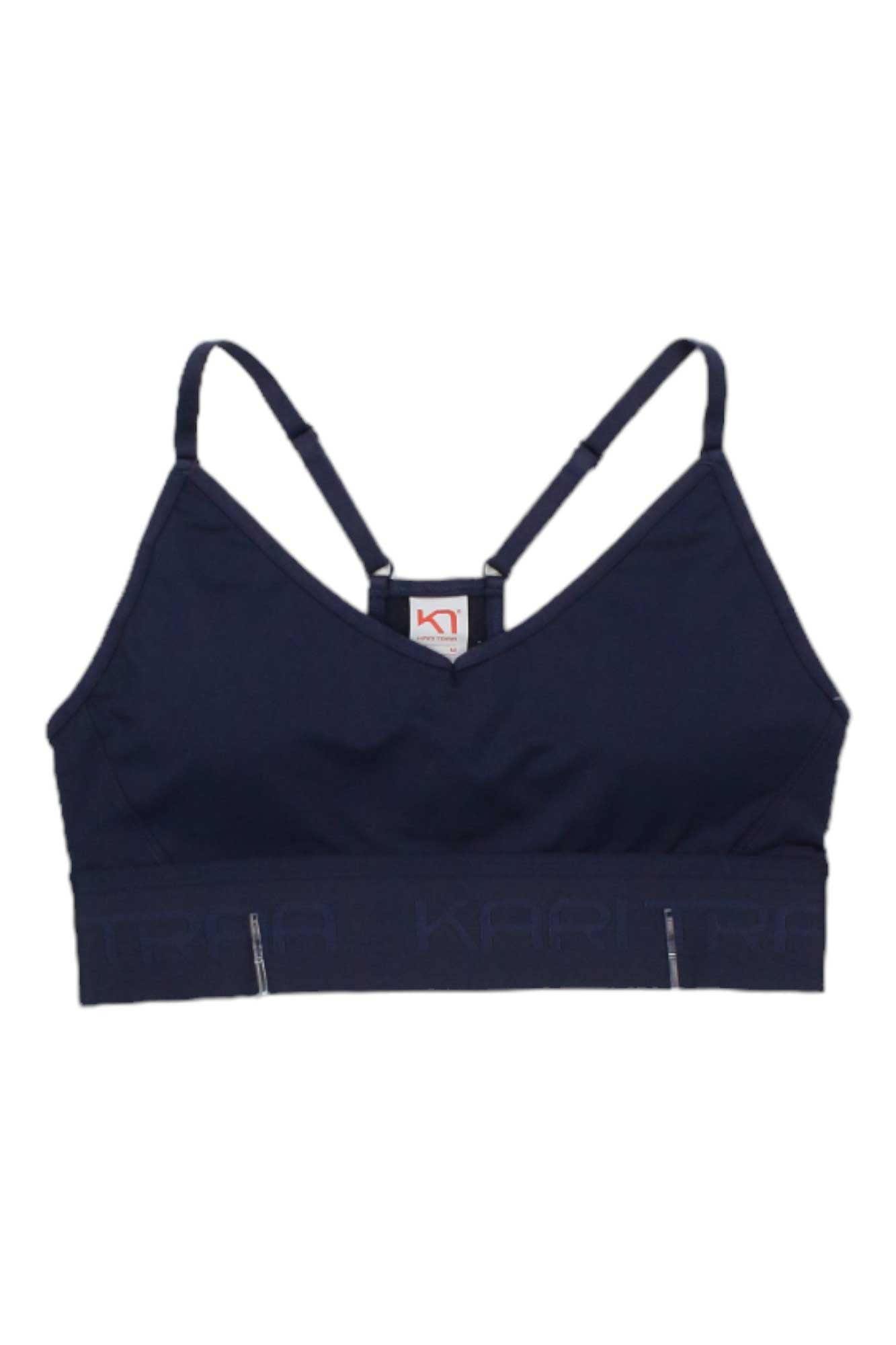 The Kari Traa Womens Var Bra is a navy blue compression sports bra with adjustable straps and a wide elastic band for support and comfort, shown on a white background.