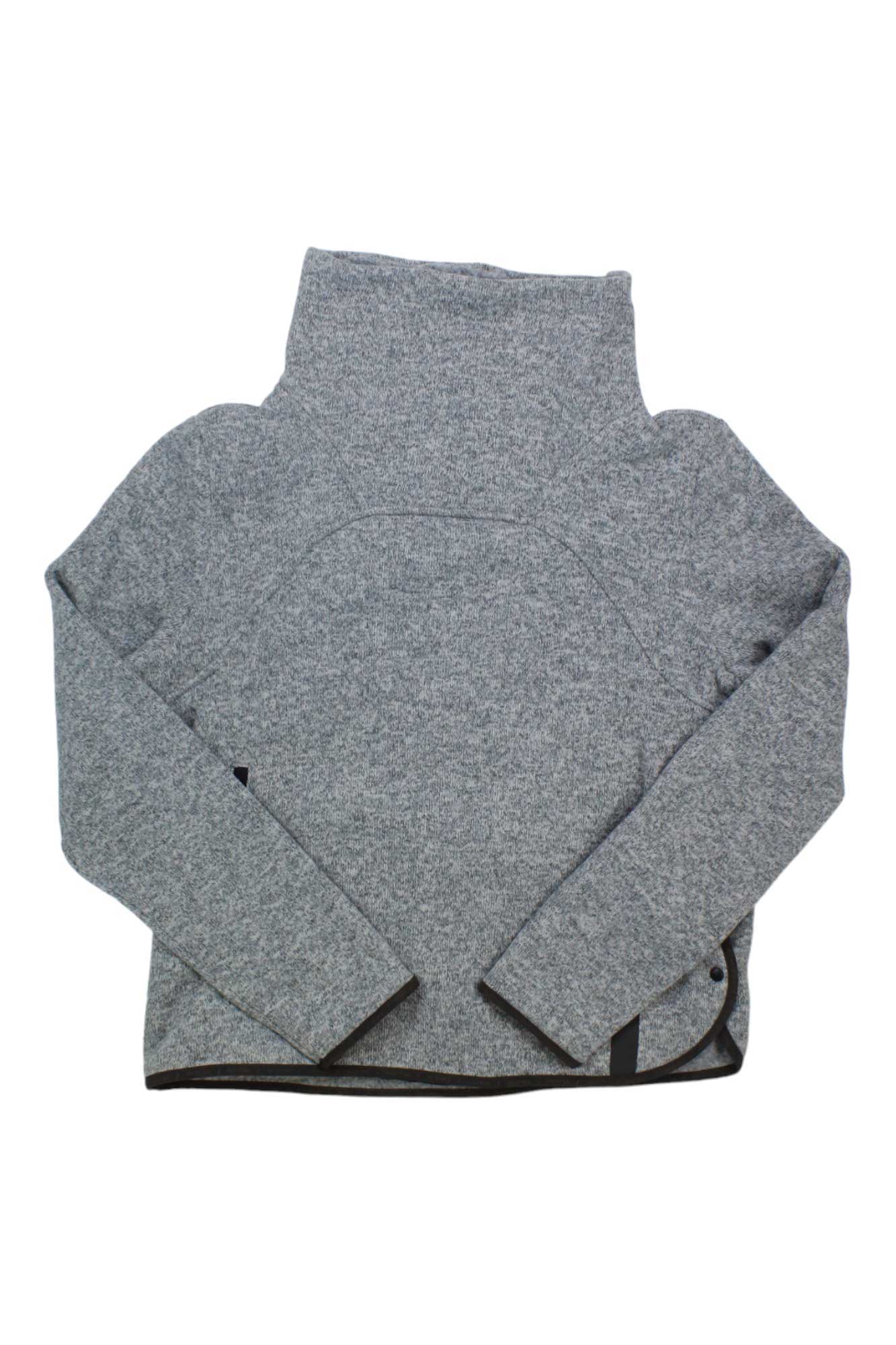 The Indyeva Womens Toga Sweater is a gray, long-sleeve, high-neck casual sweater for women. Made from recycled polyester, it features textured fabric, a minimalist design, and is shown laid flat on a white background.