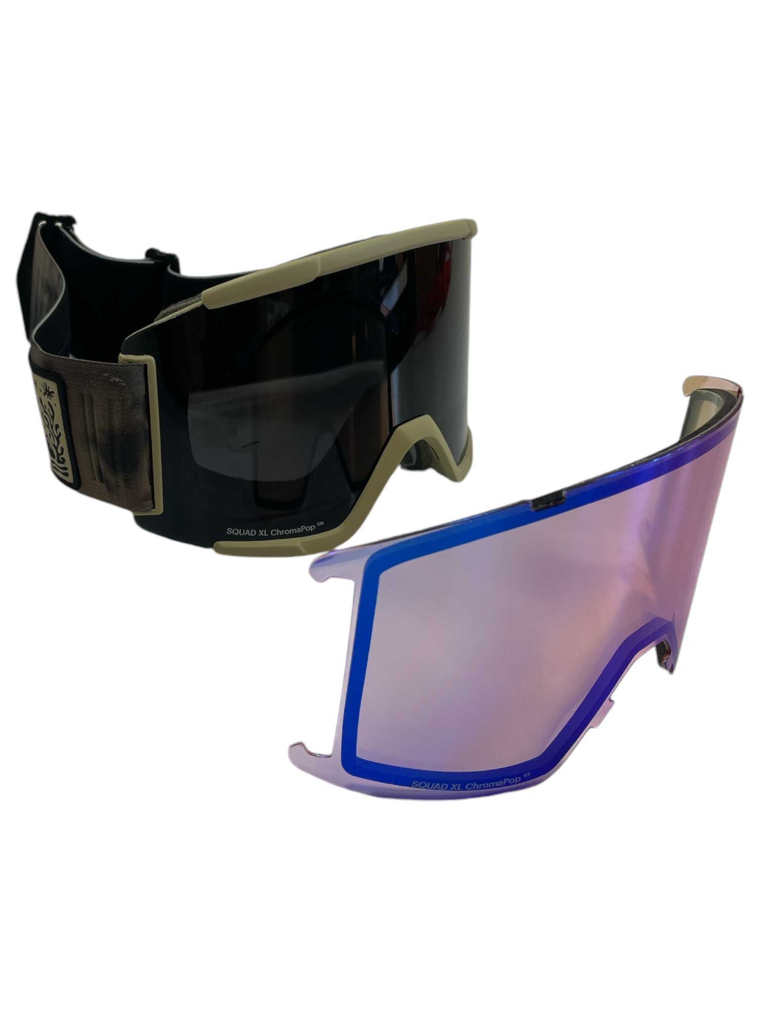 Smith Squad XL Snow Goggle with a dark anti-fog lens and beige trim, shown next to an iridescent purple ChromaPop replacement lens.