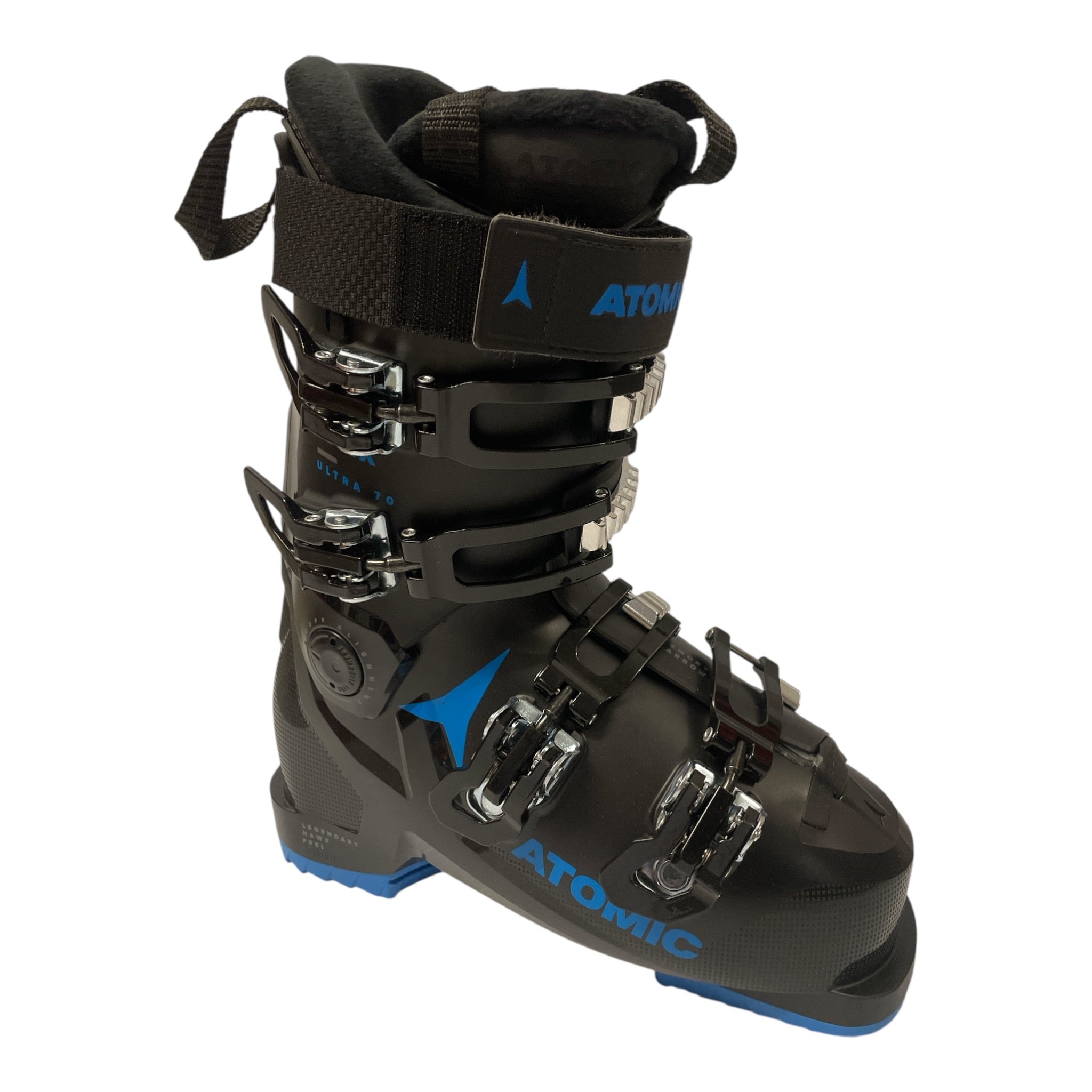 The Atomic Hawx Ultra 70 Ski Boot, in black with blue accents, features four adjustable buckles, a Velcro top strap, and a textured sole. The lightweight boot is shown angled to display both side and front details on a white background.