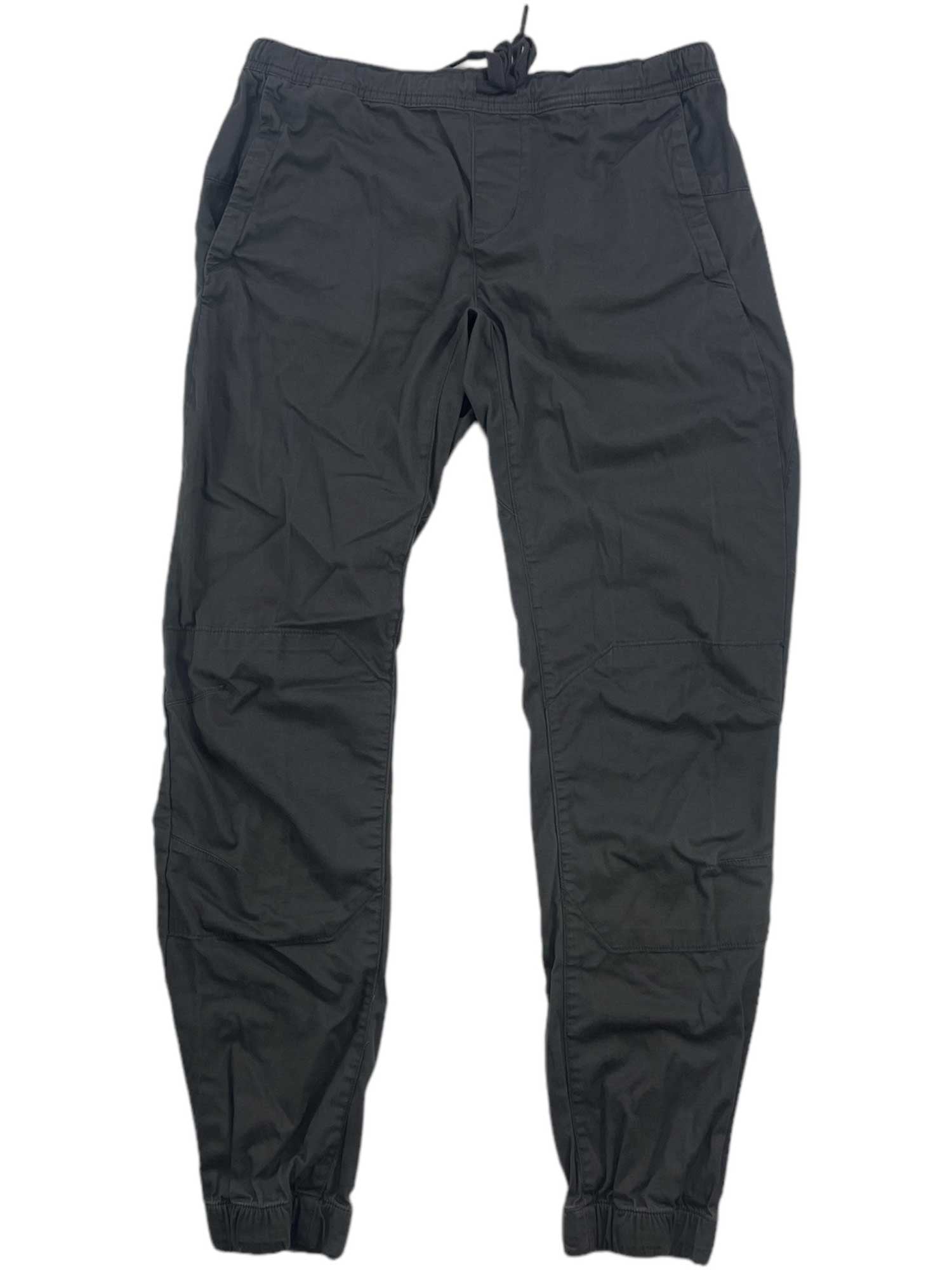 A pair of Womens Notion Pant joggers in black, with an elastic waistband, drawstring, side pockets, and elastic ankle cuffs, made from soft 4-way stretch fabric and displayed flat on a white background.