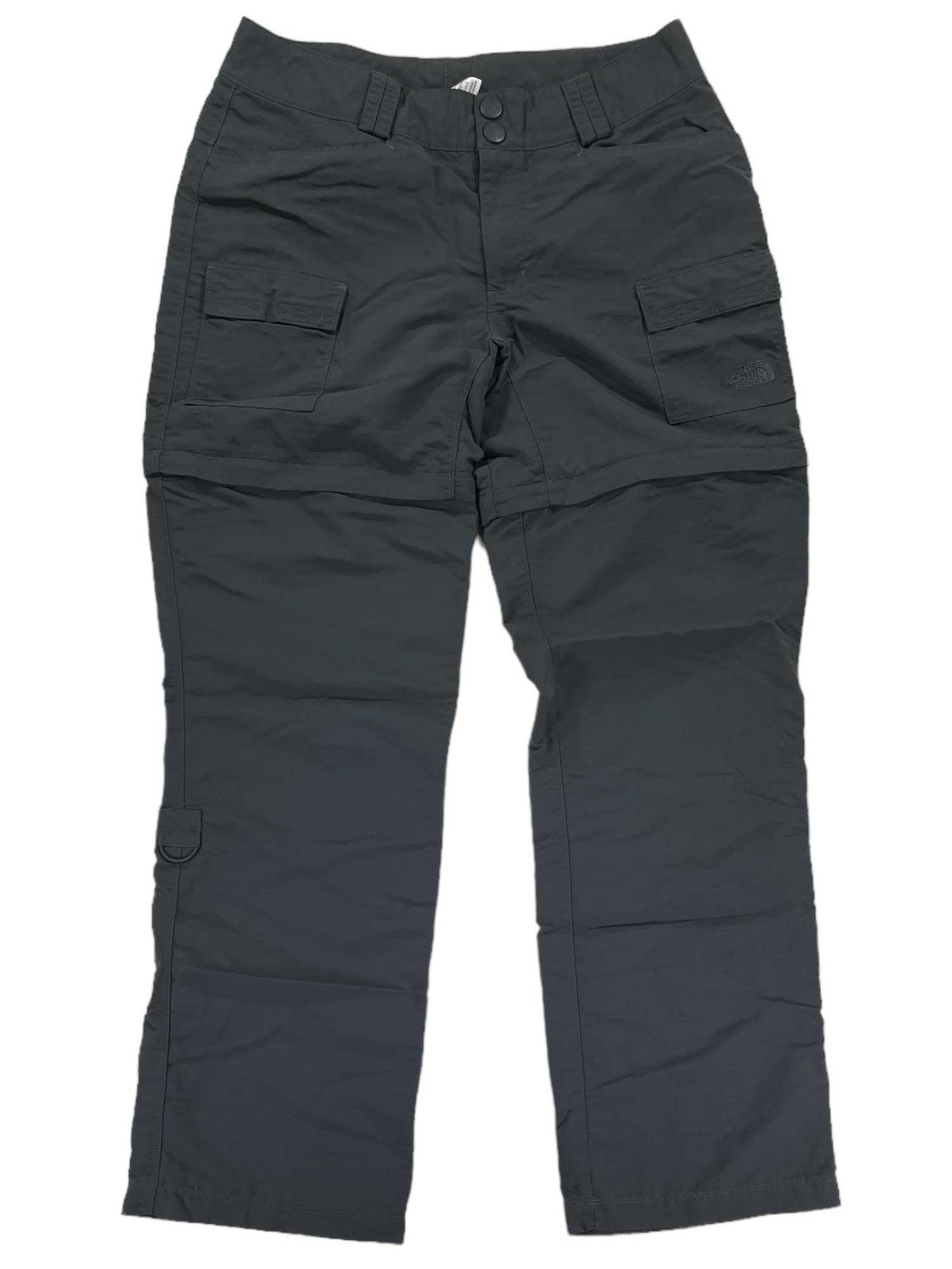 The Women's Paramount II Convertible Pants in dark gray nylon feature stretch fabric, front button and zip closure, side pockets, and two thigh flap pockets. Quick-drying pants are shown laid flat on a white background.