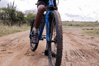 person riding a bike wearing biking shoes