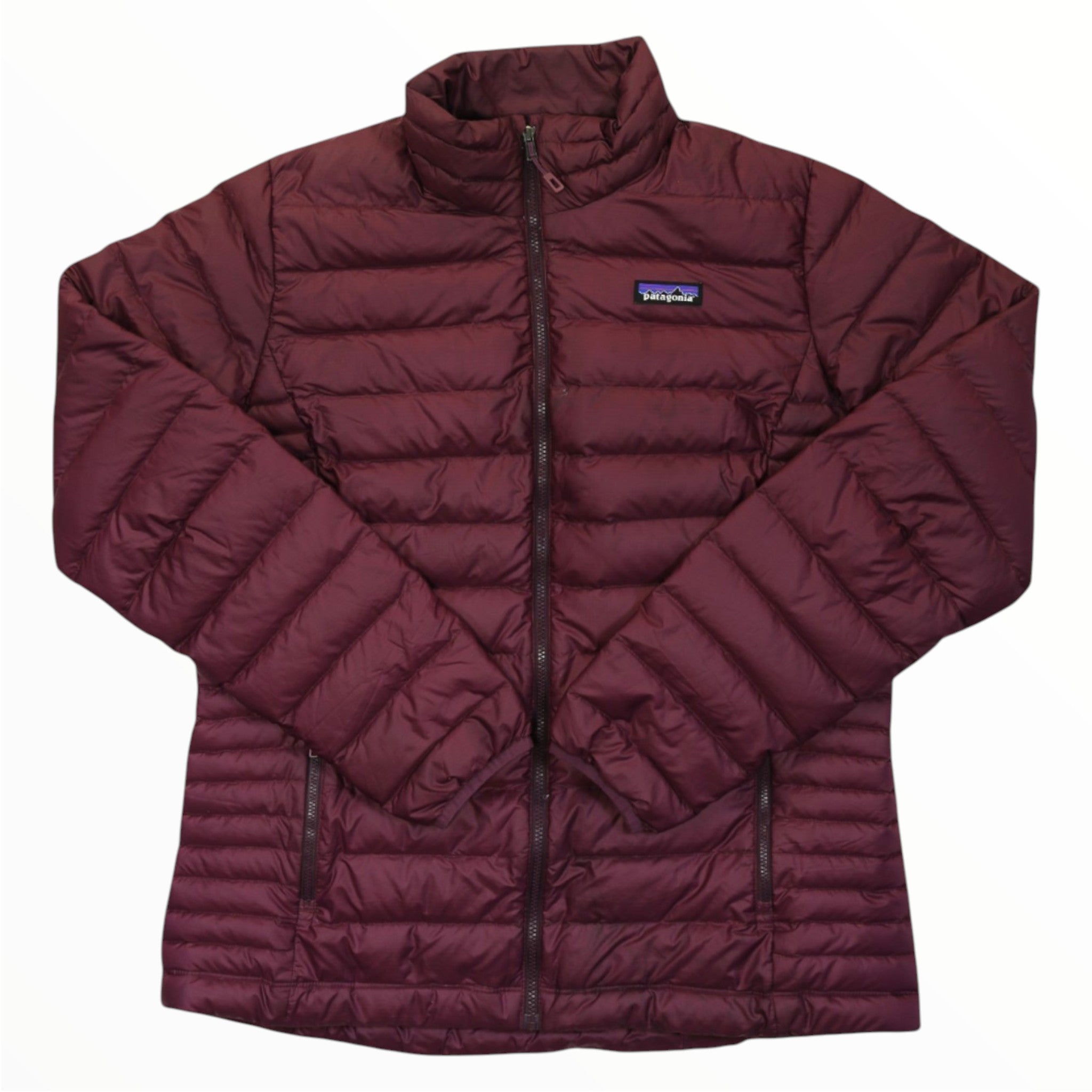 The Women's Down Sweater Jacket is maroon, quilted, and made from recycled polyester with 800-fill-power down. It features a front zipper, zippered side pockets, high collar, and a small Patagonia logo on the chest. Displayed on a white background.