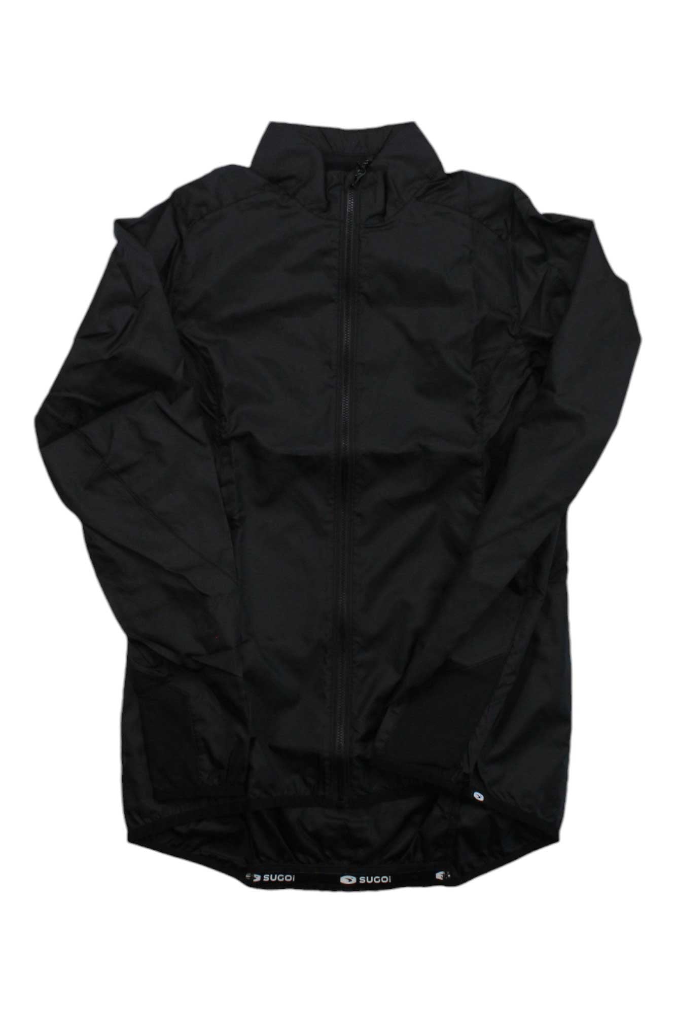 The Sugoi Stash Cycling Jacket is a black, long-sleeve, zip-up women’s cycling jacket with a high collar and subtle sheen, shown laid flat on a white background. The brand name appears on the bottom hem.