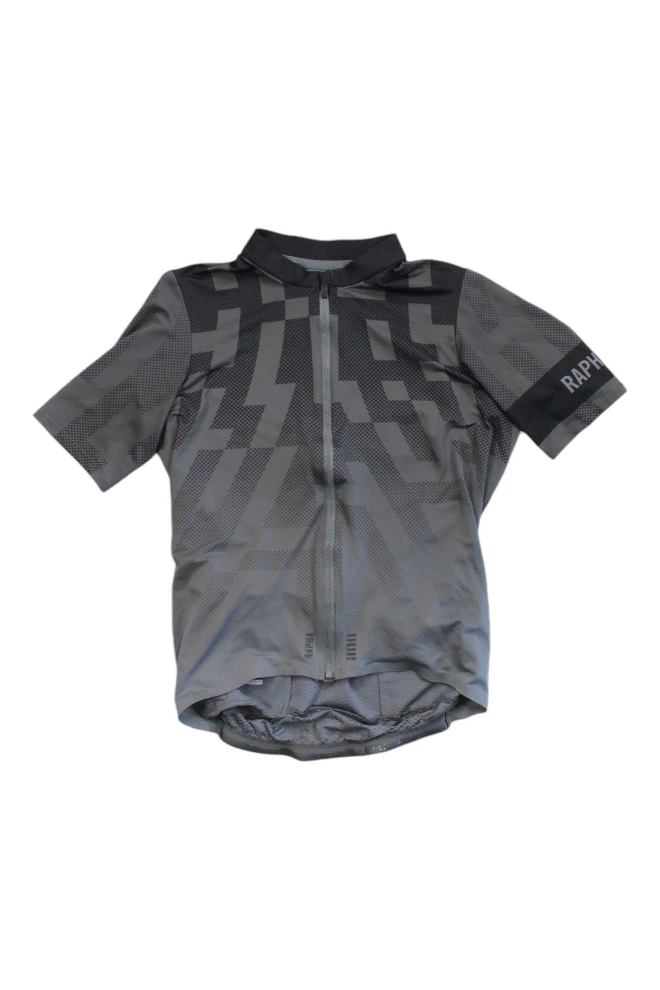 The Mens Pro Team Midweight Short Sleeve Jersey is a men's cycling jersey in gray with a geometric pattern, featuring short sleeves, a zip-up front, and RAPHA branding on the left sleeve.