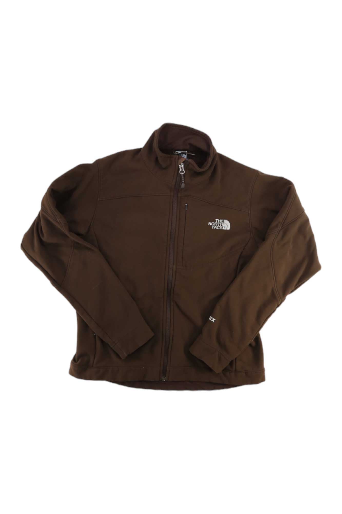 The North Face Womens Apex Bionic Soft-Shell Jacket in brown, displayed flat on a white background, features a front zipper, zippered chest pocket, and white embroidered logos on the left chest and sleeve.