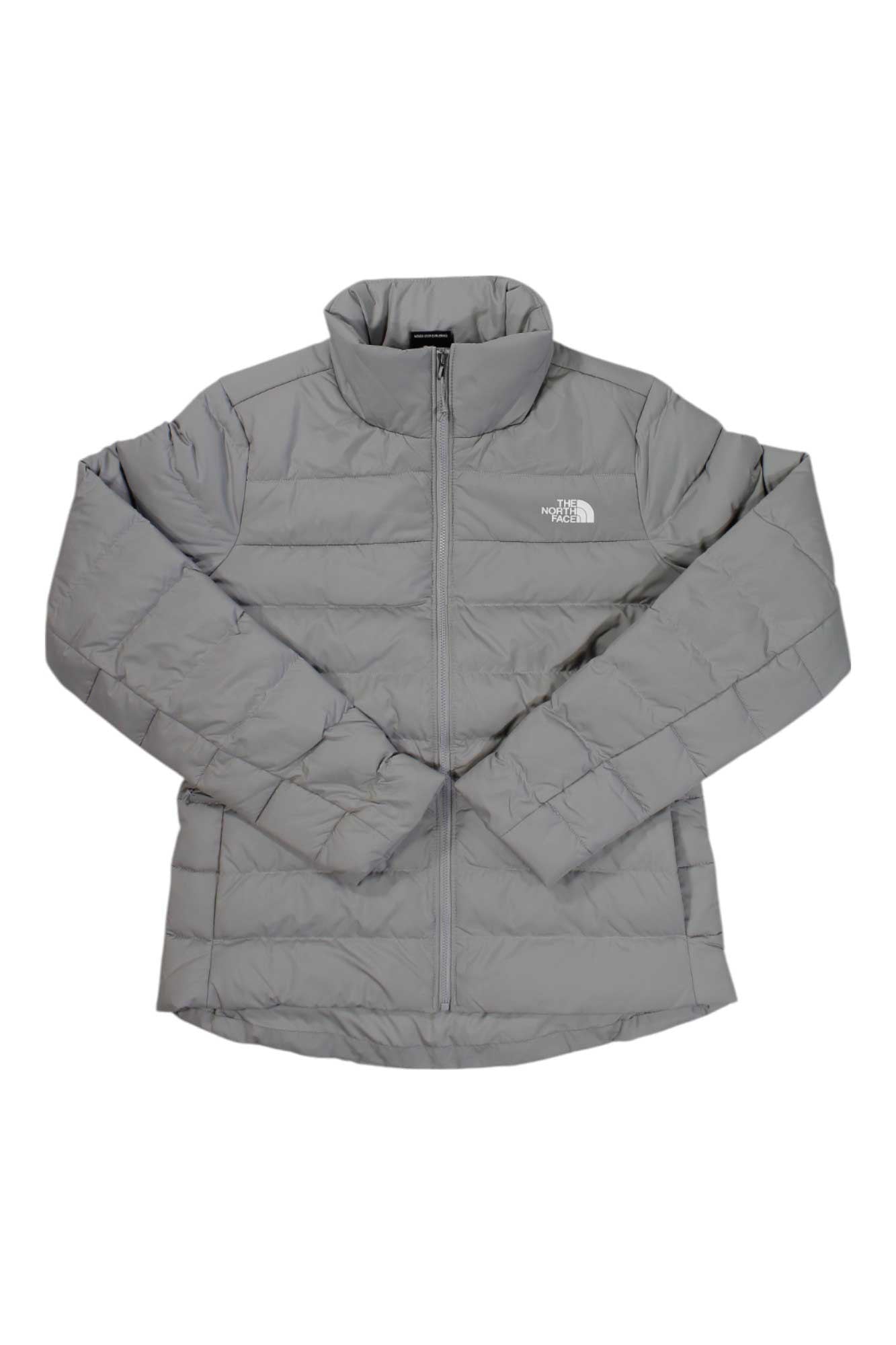 The North Face Womens Aconcagua 3 Jacket is a light gray, quilted jacket with a front zipper and high collar, crafted from recycled down. Displayed on a white background, its sleeves are slightly crossed at the wrists.