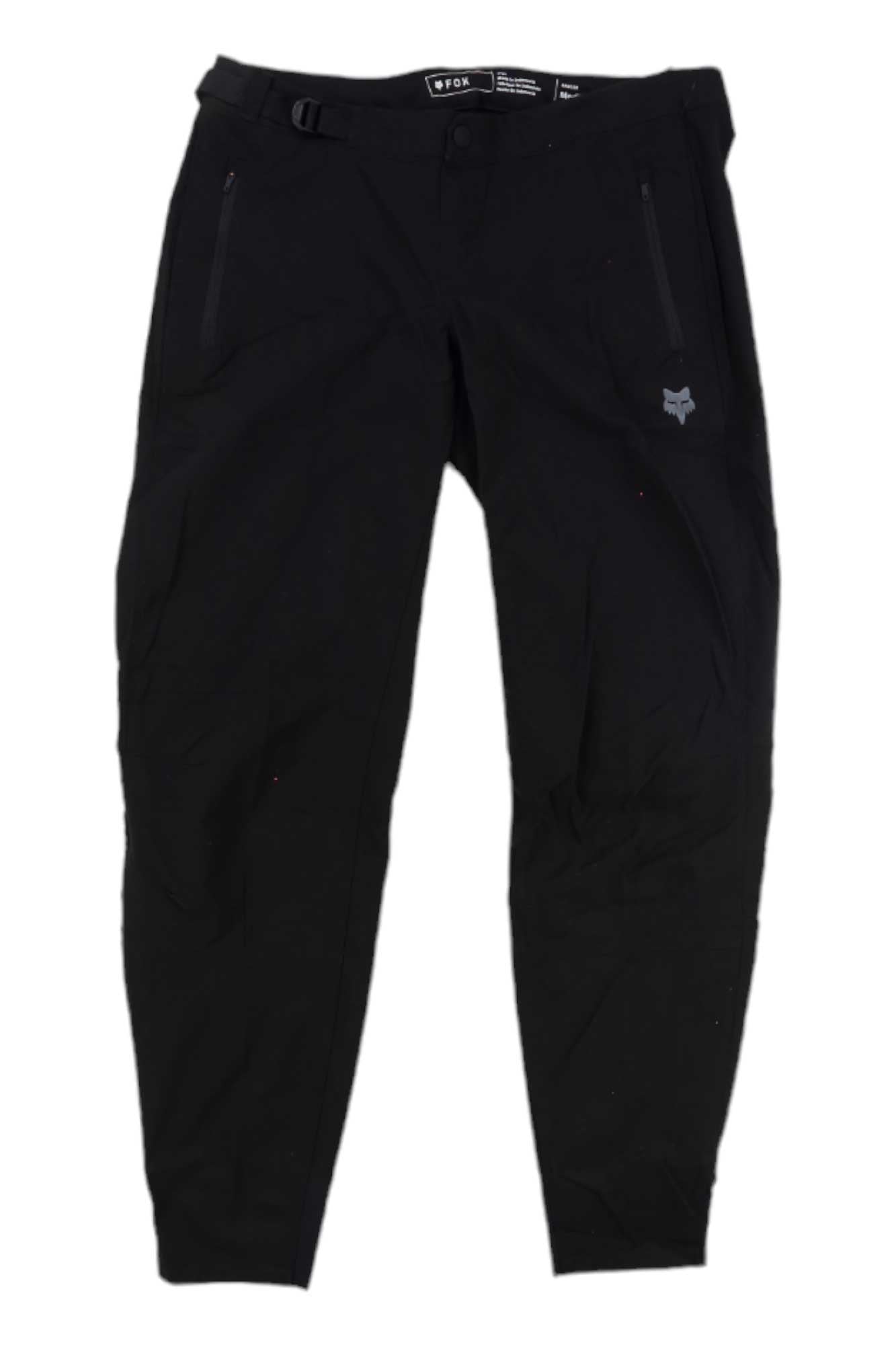 The Fox Womens Ranger Pant is a black slim-fit mountain bike pant with zippered side pockets, a left thigh fox logo, integrated waist belt, button closure, and made of technical stretch fabric.