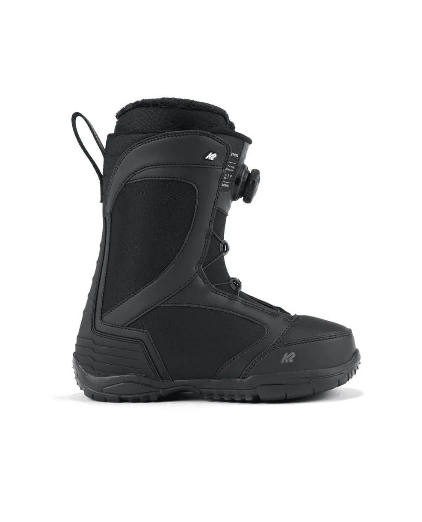 The K2 Womens Benes Snowboard Boot is shown in profile on a white background, featuring a black design with a textured sole, side handle loop, and round adjustment dial on the side.