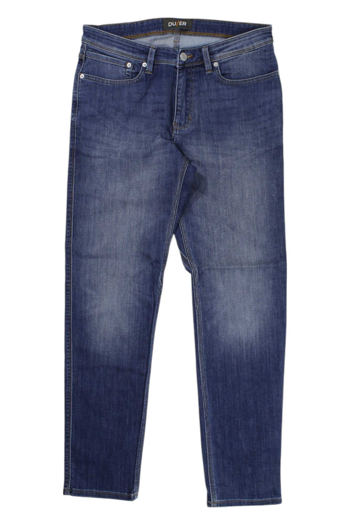 The DU/ER Mens Performance Denim Jean - Slim Fit features classic blue denim, button and zip closure, front and back pockets, and subtle thigh and knee fading, displayed flat on a white background.