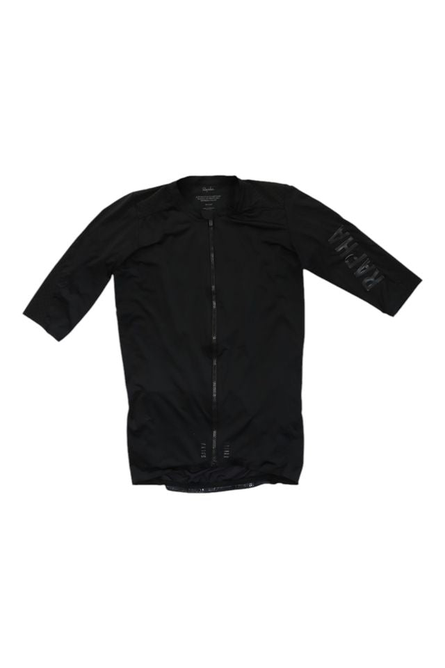 The Pro Team Aero Jersey II is a black, short-sleeve cycling jersey featuring a full front zipper and subtle Rapha lettering on the left sleeve.