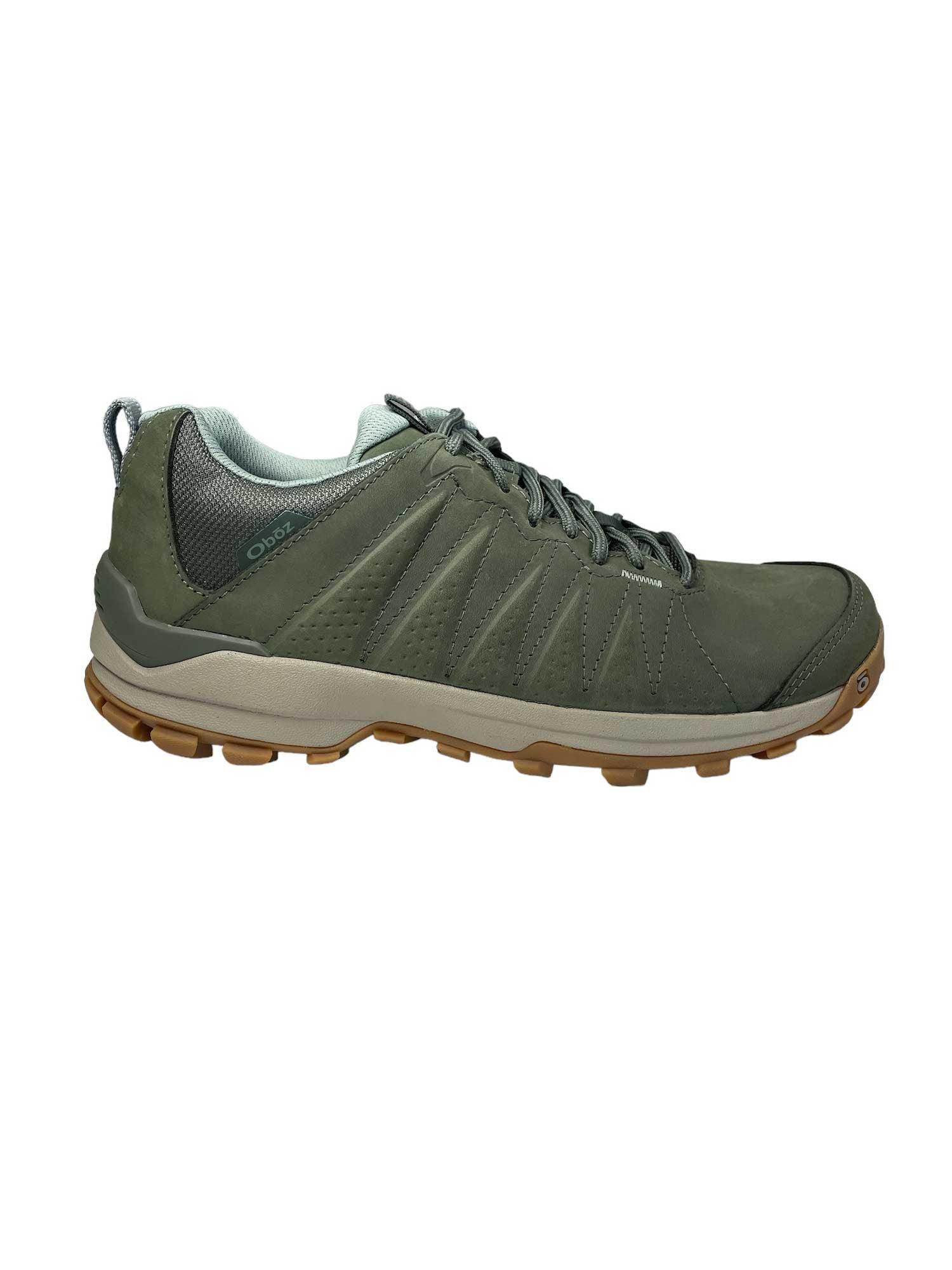 Women’s low leather hiking shoe in green, lace-up style and chunky sole for traction