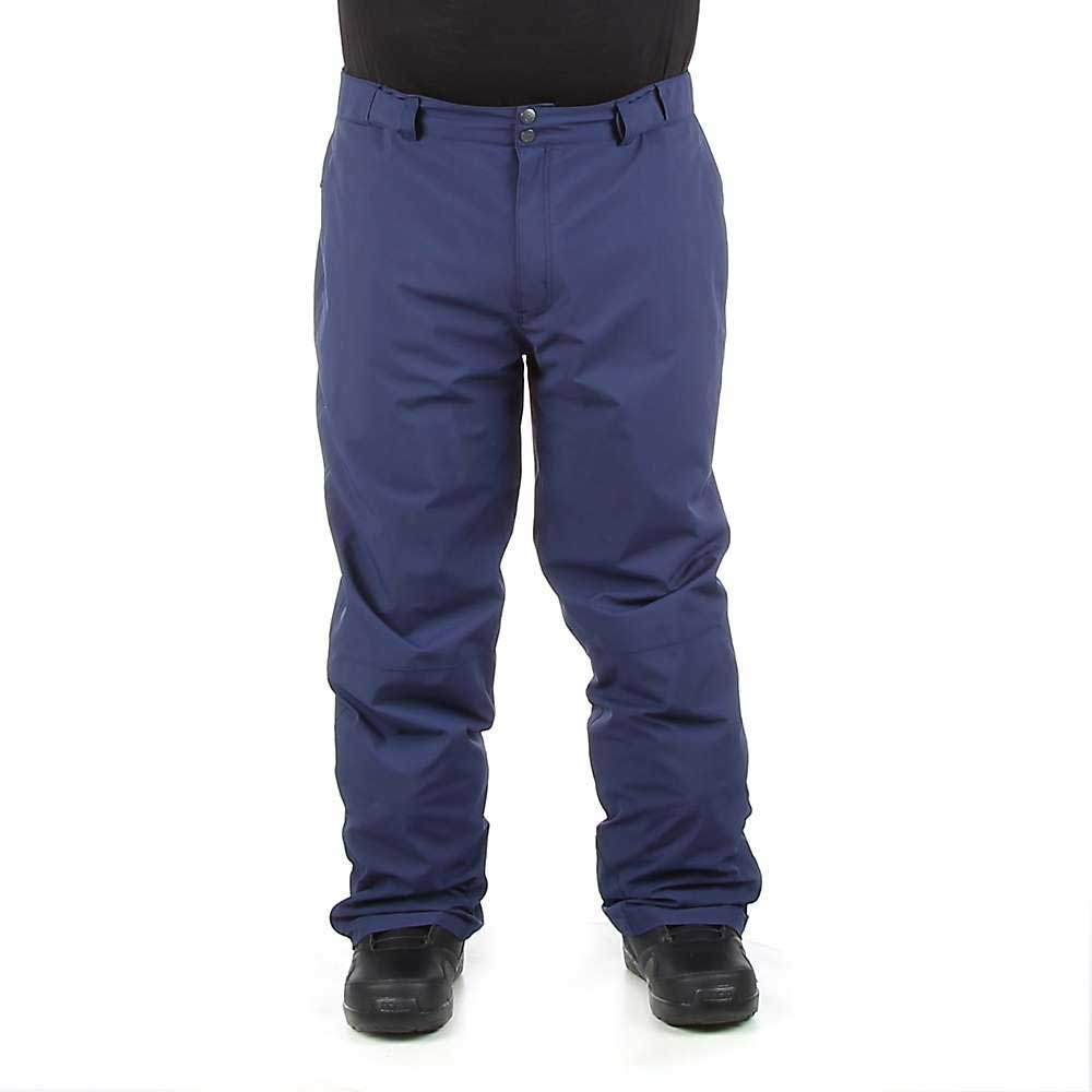 A person is shown from the shoulders down wearing Moosejaw Mens Insulated Ski and Snow Pant in blue with black shoes, standing against a plain white background. The focus is on the pants.
